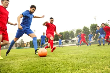 Gordijnen Playing a football match © olly