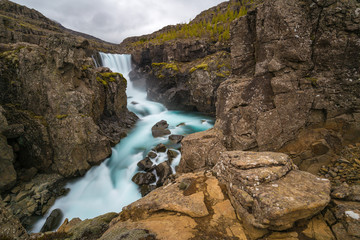 Obraz premium Sveinsstekksfoss waterfall in Eastern Fjords, Iceland