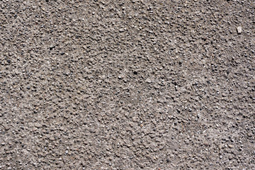 Grey concrete floor with gravel