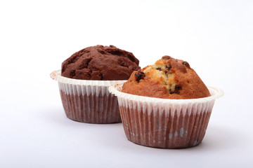 Fresh homemade muffins on white background. Top view.