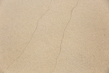 closeup of sand pattern of a beach in the summer