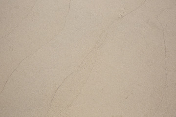 closeup of sand pattern of a beach in the summer