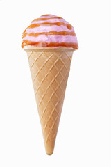 Pink ice cream with caramel sauce with sprinkles in a waffle cone