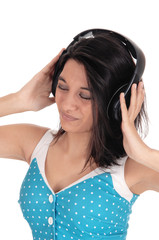Naklejka premium Woman listening to music with headphones.