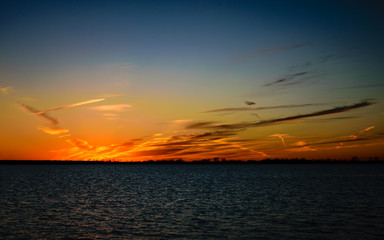 Wispy sunset by the lake