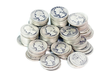 Stacks of vintage silver quarters.