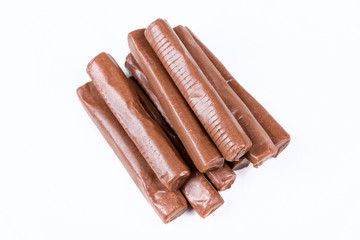 Chewy chocolate logs isolated on a white background