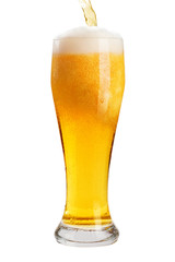 A glass of cold beer with foam, clipping path, bubbles in a drink, on a white background, isolated
