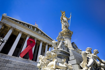 Obraz premium Aids Awareness Ribbon on Austrian Parliament