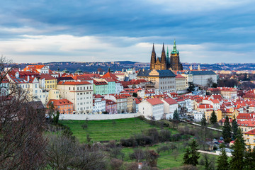 Fototapeta premium Spring Prague panorama from Prague Hill with Prague Castle, Vltava river and historical architecture. Concept of Europe travel, sightseeing and tourism.