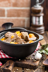 Delicious braised beef meat in broth with vegetables, goulash