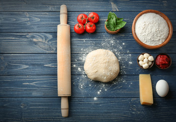 Ingredients for pizza on wooden  background