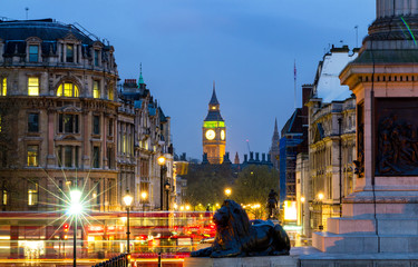 London Trafalgar Square lion and Big Ben tower at background, London, UK