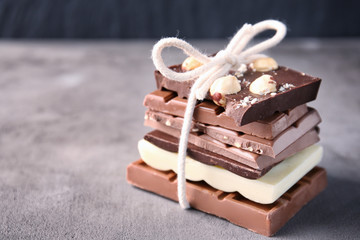 Tied chocolate pieces on table