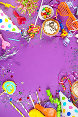 Flat lay. Festive objects on purple background
