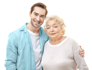 Young man with grandmother on white background