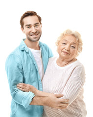 Young man with grandmother on white background