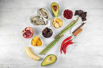 Different aphrodisiac food for increasing sexual desire on wooden table