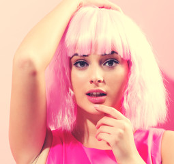 Beautiful woman in a bright pink wig