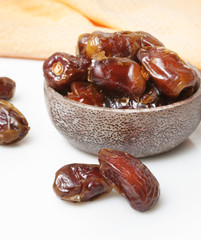Dried dates in small bowl