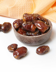 Dried dates in small bowl