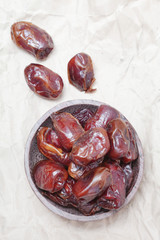 Dried dates in small bowl 