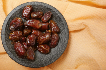 Dried dates in small bowl