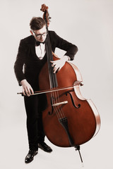 Double bass player playing contrabass