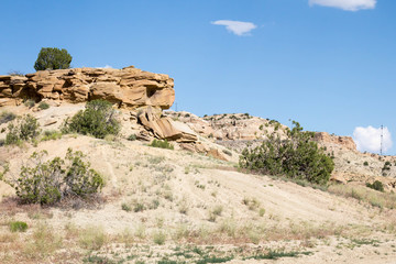 Fototapeta premium Sandstone hilltop and sandy slope in northern New Mexico