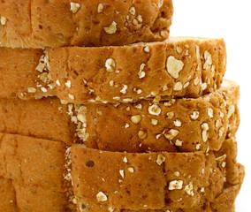 Closeup of Fresh sliced wholewheat bread with various seeds and multigrain on white background