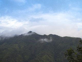 Fototapeta na wymiar Fog and clouds above the mountains in rainy season at Thailand.