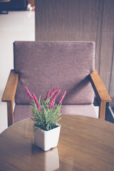 Vintage flower on table with luxury chair