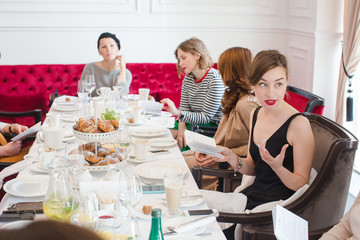 Women sitting at served table