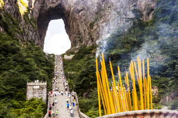 Many people climbing the steep steps at Tianmen Mountain, which is also known as heavenly gate mountain, in Hunan Province