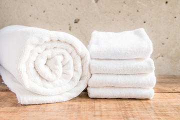 Obraz na płótnie Canvas Stacked white spa towels