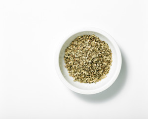 Bowl of dried oregano leaves