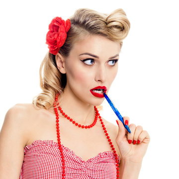 young woman with pen, in pin-up style clothing, isolated