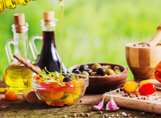vegetables with oil on wooden table outdoor