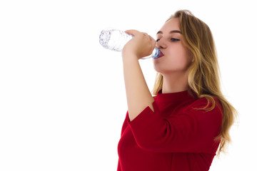 Young pretty girl drinks fresh water  