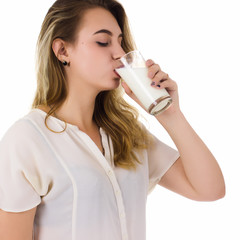 Young pretty girl, glass of milk, white background  