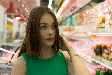 Young pretty girl in a mall, food and drinks  