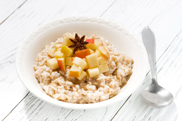 plate of oatmeal with apples
