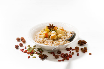 plate of sweet oatmeal with apples and spices