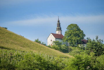 Fototapeta na wymiar small church on top of a hill. long shoot