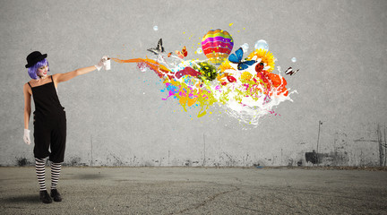 Woman clown with colored spray