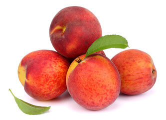Peach. Fruit with green leaf isolated on white background