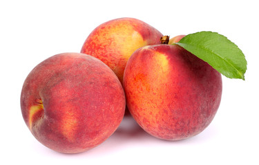 Peach. Fruit with green leaf isolated on white background