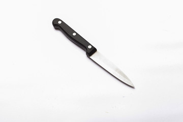 silver knife with dark handle on a white background