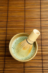 Bamboo whisk in green tea