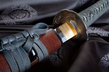 Fotobehang Japanese sword on silk © Anneke